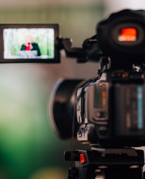Camera recording at a press conference. Live streaming.